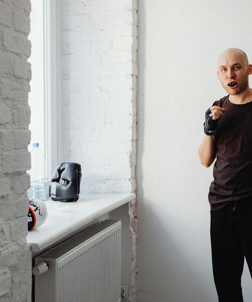 Man in a power stance showing strength and focus.